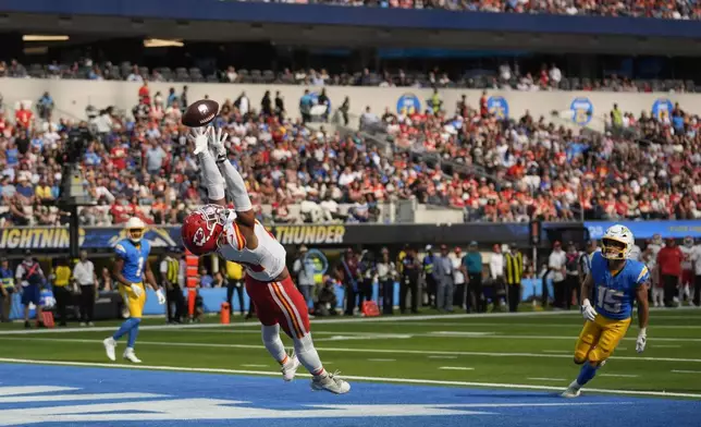 Kansas City Chiefs defensive back Jaden Hicks is unable to make an interception in the end zone during the second half of an NFL football game against the Los Angeles Chargers Sunday, Sept. 29, 2024, in Inglewood, Calif. (AP Photo/Marcio Jose Sanchez)