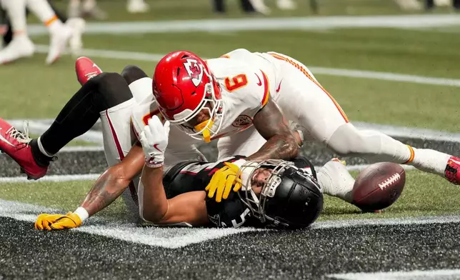 Atlanta Falcons wide receiver Drake London (5) misses the catch in the end zone against Kansas City Chiefs safety Bryan Cook (6) during the second half of an NFL football game, Sunday, Sept. 22, 2024, in Atlanta. (AP Photo/Brynn Anderson)