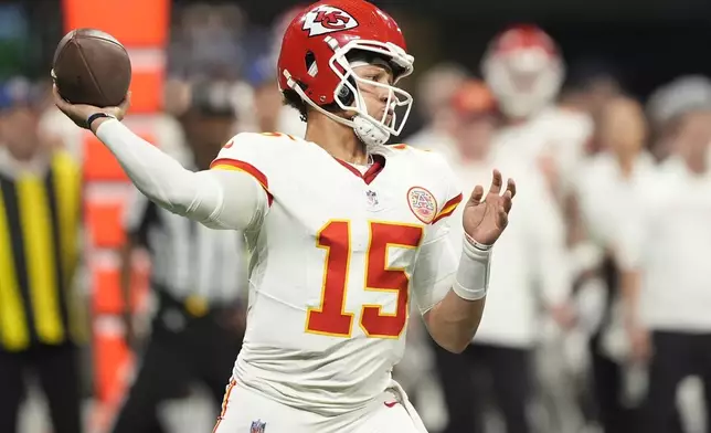 Kansas City Chiefs quarterback Patrick Mahomes works in the pocket against the Atlanta Falcons during the first half of an NFL football game, Sunday, Sept. 22, 2024, in Atlanta. (AP Photo/Brynn Anderson)