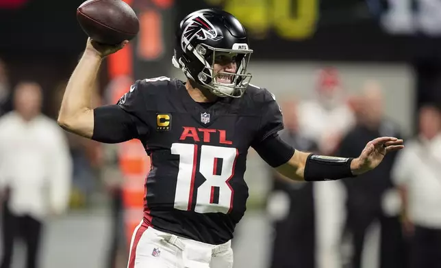 Atlanta Falcons quarterback Kirk Cousins (18) works in the pocket against the Kansas City Chiefs during the first half of an NFL football game, Sunday, Sept. 22, 2024, in Atlanta. (AP Photo/Brynn Anderson)