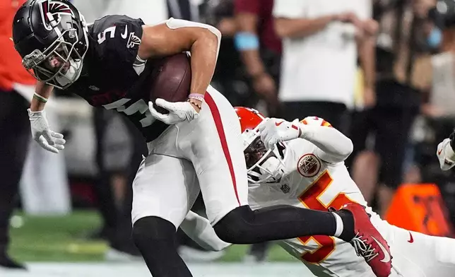 Atlanta Falcons wide receiver Drake London (5) runs against Kansas City Chiefs cornerback Jaylen Watson (35) during the second half of an NFL football game, Sunday, Sept. 22, 2024, in Atlanta. (AP Photo/Brynn Anderson)