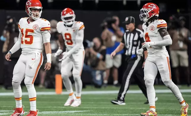 Kansas City Chiefs quarterback Patrick Mahomes (15) celebrates the touchdown by wide receiver Rashee Rice (4) during the first half of an NFL football game against the Atlanta Falcons, Sunday, Sept. 22, 2024, in Atlanta. (AP Photo/Brynn Anderson)