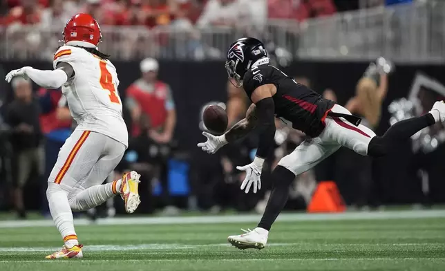 Atlanta Falcons safety Jessie Bates III (3) breaks up a pass intended for Kansas City Chiefs wide receiver Rashee Rice (4) during the first half of an NFL football game, Sunday, Sept. 22, 2024, in Atlanta. (AP Photo/Brynn Anderson)