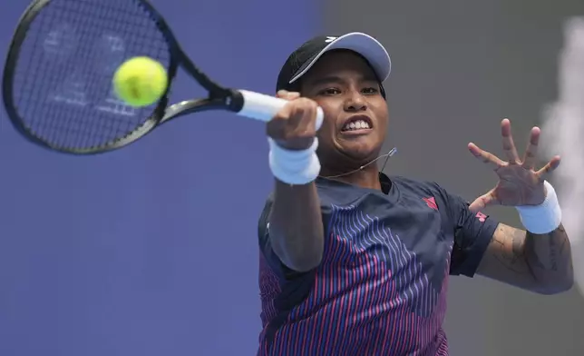 Mananchaya Sawangkaew of Thailand returns a shot to Aryna Sabalenka of Belarus during the China Open tennis tournament held at the National Tennis Center in Beijing, Saturday, Sept. 28, 2024. (AP Photo/Ng Han Guan)