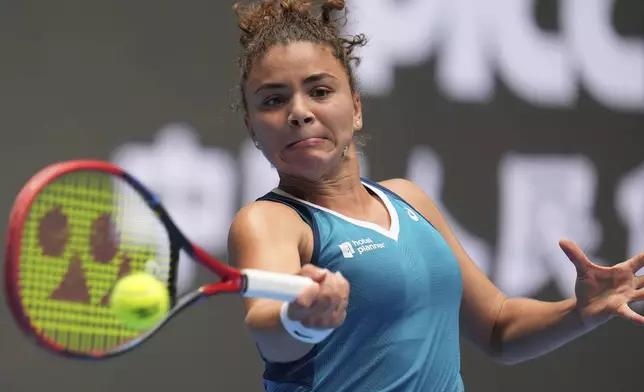 Jasmine Paolini of Italy returns a shot from Clara Tauson of Denmark during the China Open tennis tournament held at the National Tennis Center in Beijing, Saturday, Sept. 28, 2024. (AP Photo/Ng Han Guan)