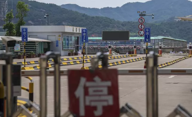 In this photo released by Xinhua News Agency, a ferry terminal is closed as they brace for impact from Typhoon Bebinca, in Xiangshan County, east China's Zhejiang Province, Sunday, Sept. 15, 2024. (Jiang Han/Xinhua via AP)