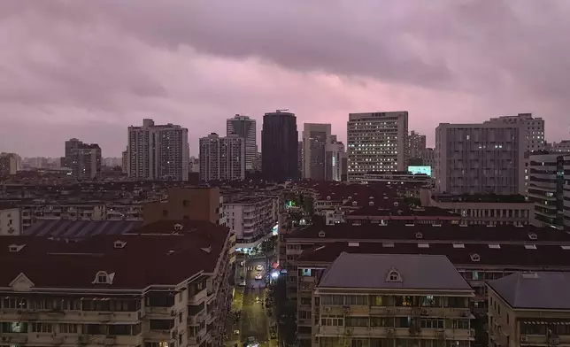 A view of pink cloudy skyline is seen in Shanghai, China, Sunday, Sept. 15, 2024. (Chinatopix Via AP)