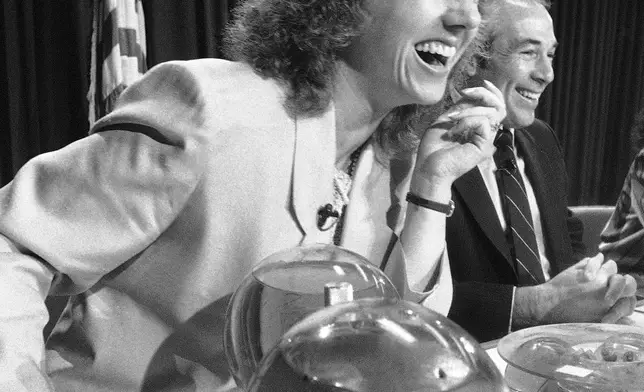 FILE - Space teacher Christa McAuliffe responds to a question at a press conference at the Johnson Space Center in Houston, Texas, Dec. 13, 1985. (AP Photo/R.J. Carson, File)