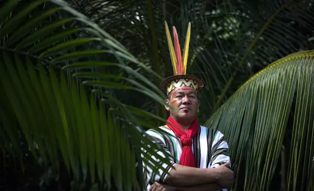 Ashaninka Indigenous leader Francisco Piyako poses for a portrait during the annual celebration recognizing the Ashaninka territory in the Apiwtxa village, Acre state, Brazil, Monday, June 24, 2024. (AP Photo/Jorge Saenz)