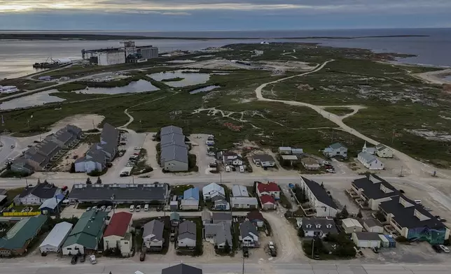 A grain port, top left, stands on the outskirts of town, Wednesday, Aug. 7, 2024, in Churchill, Manitoba. (AP Photo/Joshua A. Bickel)