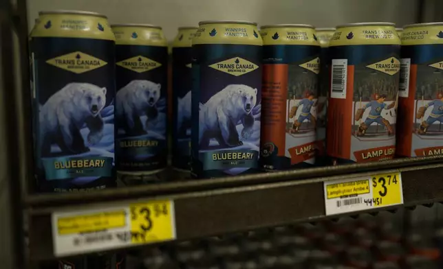 A can of beer with a polar bear on its label sits on a shelf, Saturday, Aug. 3, 2024, at a market in Churchill, Manitoba. (AP Photo/Joshua A. Bickel)