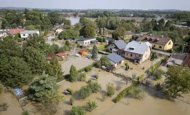 FILE - Floodwater surrounds a neighborhood in Bohumin, Czech Republic, Sept. 17, 2024. (AP Photo/Darko Bandic, File)