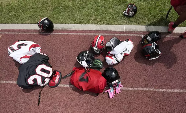 Equipment sits on the field as the Baker High football teams readies for practice in Baker, La., Wednesday, Aug. 28, 2024. (AP Photo/Gerald Herbert)