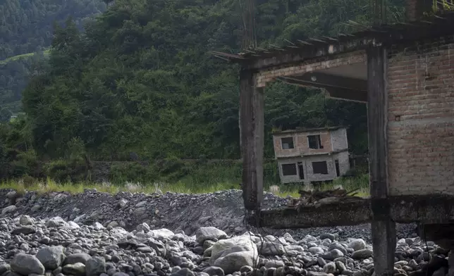 Abandoned houses are visible in Chanaute Market, northeast of Kathmandu, Nepal, Sunday, Sept. 15, 2024. (AP Photo/Niranjan Shrestha)