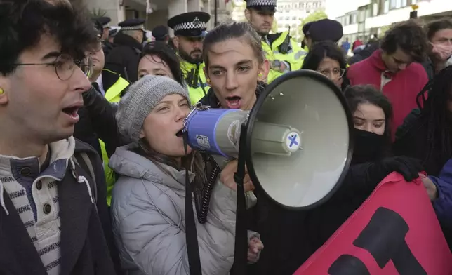 FILE - Environmental activist Greta Thunberg shouts slogans during the Oily Money Out protest outside the Intercontinental Hotel, in London, Oct. 17, 2023. (AP Photo/Kin Cheung, File)