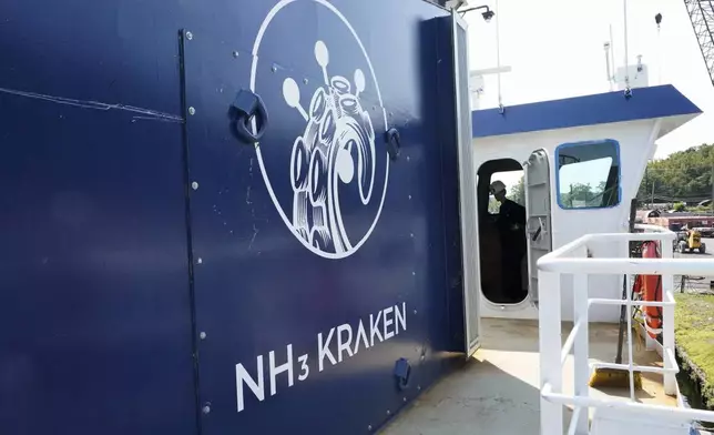 Abigail Jablansky, head of project management, stands in the captain area of the NH3 Kraken, a tugboat powered by ammonia, Friday, Sept. 13, 2024, in Kingston, N.Y. (AP Photo/Alyssa Goodman)