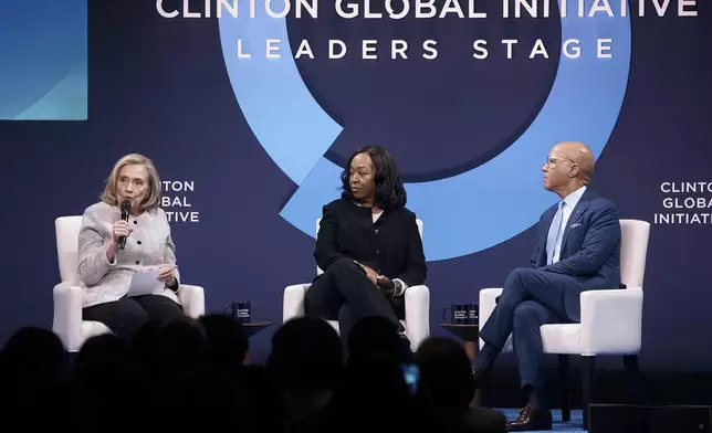 Former U.S. Secretary of State, Hillary Clinton, from left, speaks as American television producer and screenwriter, Shonda Rhimes, and President of the Ford Foundation, Darren Walker, listen during the Clinton Global Initiative, on Tuesday, Sept. 24, 2024, in New York. (AP Photo/Andres Kudacki)