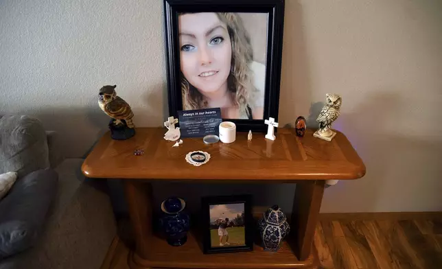 A tribute to Rikki Olds, who was fatally shot along with nine other people at a grocery store in Boulder, Colo., in 2021, is set up in her grandmother's home in Lafayette, Colo., Tuesday, Aug. 27, 2024. (AP Photo/Thomas Peipert)