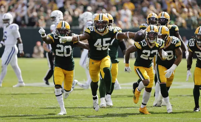 Green Bay Packers linebacker Eric Wilson (45) celebrate as intercepting a pass during the second half of an NFL football game against the Indianapolis Colts Sunday, Sept. 15, 2024, in Green Bay, Wis. (AP Photo/Mike Roemer)