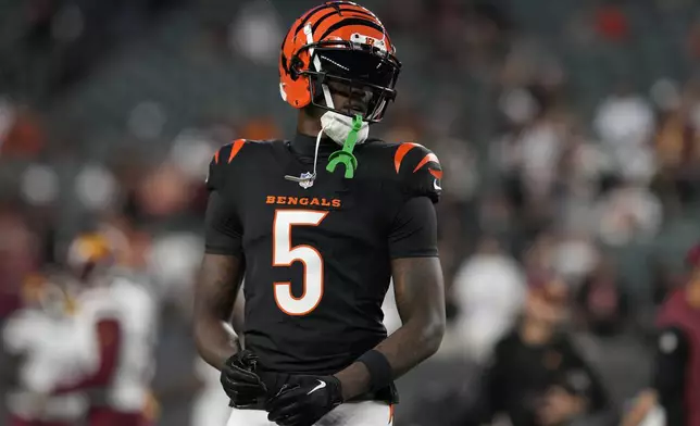 Cincinnati Bengals wide receiver Tee Higgins (5) warms up before an NFL football game against the Washington Commanders, Monday, Sept. 23, 2024, in Cincinnati. (AP Photo/Jeff Dean)