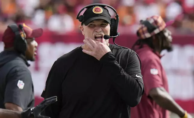 Washington Commanders head coach Dan Quinn paces the sideline during the first half of an NFL football game against the Tampa Bay Buccaneers Sunday, Sept. 8, 2024, in Tampa, Fla. (AP Photo/Chris O'Meara)