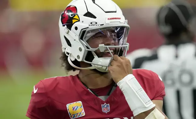 Arizona Cardinals quarterback Kyler Murray smiles during the first half of an NFL football game against the Washington Commanders, Sunday, Sept. 29, 2024, in Glendale, Ariz. (AP Photo/Ross D. Franklin)