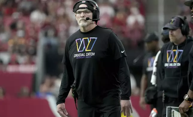 Washington Commanders head coach Dan Quinn watches play during the first half of an NFL football game against the Arizona Cardinals, Sunday, Sept. 29, 2024, in Glendale, Ariz. (AP Photo/Rick Scuteri)