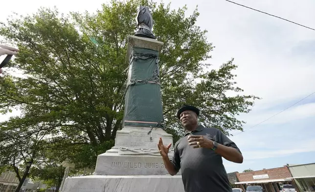 Charles Latham speaks near a century-old Confederate memorial statue in Grenada, Miss., April 12, 2023. (AP Photo/Rogelio V. Solis)