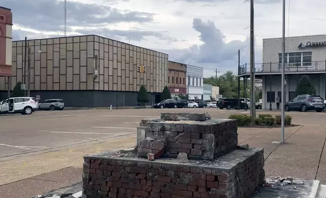 A base that had held a Confederate monument in downtown Grenada, Miss., since 1910, stands empty after a crew removed the monument, Wednesday, Sept. 11, 2024.( AP Photo/Emily Wagster Pettus)