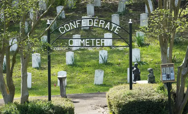 The sun sets on the grave markers in the Confederate Cemetery in Grenada, Miss., April 12, 2023. (AP Photo/Rogelio V. Solis)