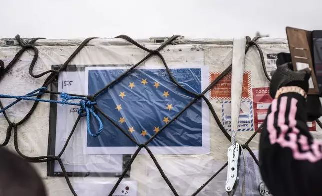 The European flag adorns a shipment of Mpox vaccine MVA-BN vaccine, manufactured by the Danish company Bavarian Nordic, as it is offloaded from a plane in Kinshasa, Congo, Thursday, Sept. 5, 2024. (AP Photo/Samy Ntumba Shambuyi)