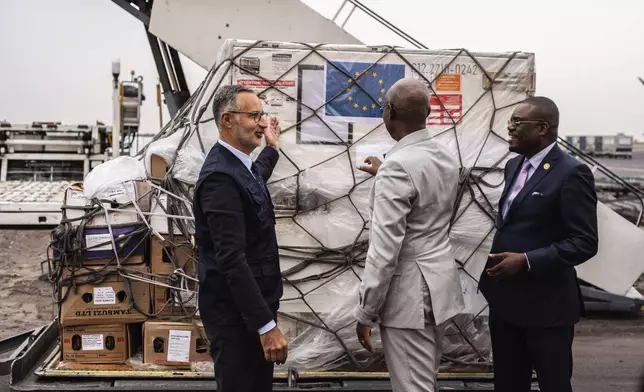 Officials check Mpox vaccine MVA-BN vaccine, manufactured by the Danish company Bavarian Nordic, at the airport in Kinshasa, Congo, Thursday, Sept. 5, 2024. (AP Photo/Samy Ntumba Shambuyi)