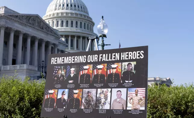 A display showing fallen American military members is displayed for a news conference by House Foreign Affairs Committee Chairman Michael McCaul, R-Texas, as he releases his panel's Afghanistan Report and the findings of its three-year investigation into the deadly U.S. withdrawal from Afghanistan, at the Capitol in Washington, Monday, Sept. 9, 2024. (AP Photo/J. Scott Applewhite)