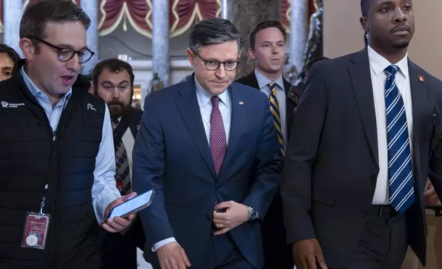 Speaker of the House Mike Johnson, R-La., walks to the chamber for the final votes of the week, at the Capitol in Washington, Friday, Sept. 20, 2024. Days after a gunman was arrested on former President Donald Trump's golf course, the House on Friday overwhelmingly passed bipartisan legislation 405-0 to require the agency use the same standards when assigning agents to major presidential candidates as they do presidents and vice presidents. (AP Photo/J. Scott Applewhite)