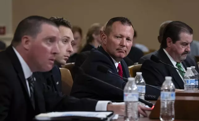 From left, Sgt. Edward Lenz, Commander of Butler County Emergency Services Unit, Patrolman Drew Blasko of Butler Township Police Department, Lt. John Herold of Pennsylvania State Police, and former U.S. Secret Service agent Patrick Sullivan, testify at the first public hearing of a bipartisan congressional task force investigating the assassination attempts against Republican presidential nominee former President Donald Trump, on Capitol Hill in Washington, Thursday, Sept. 26, 2024. (AP Photo/Ben Curtis)