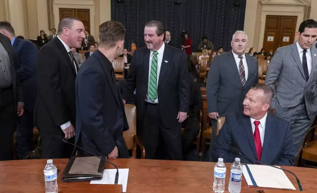 From left, Sgt. Edward Lenz, Commander of Butler County Emergency Services Unit, Patrolman Drew Blasko of Butler Township Police Department, former U.S. Secret Service agent Patrick Sullivan, and Lt. John Herold of Pennsylvania State Police, arrive to testify at the first public hearing of a bipartisan congressional task force investigating the assassination attempts against Republican presidential nominee former President Donald Trump, at Capitol Hill in Washington, Thursday, Sept. 26, 2024. (AP Photo/Ben Curtis)