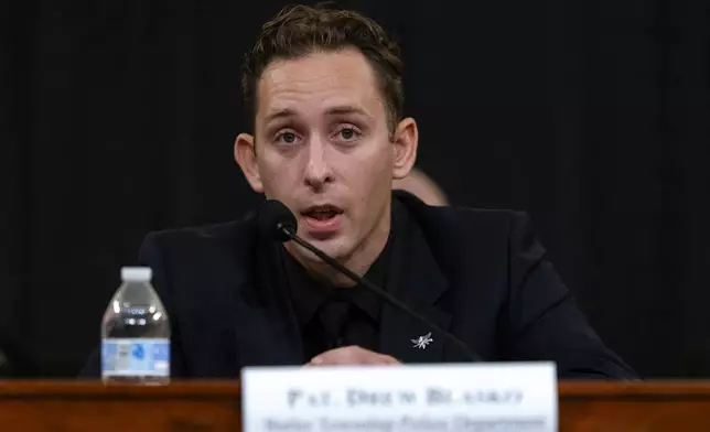 Patrolman Drew Blasko of Butler Township Police Department, testifies at the first public hearing of a bipartisan congressional task force investigating the assassination attempts against Republican presidential nominee former President Donald Trump, at Capitol Hill in Washington, Thursday, Sept. 26, 2024. (AP Photo/Ben Curtis)