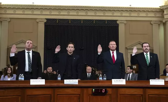 From left, Sgt. Edward Lenz, Commander of Butler County Emergency Services Unit, Patrolman Drew Blasko of Butler Township Police Dept., Lt. John Herold of Pennsylvania State Police, and former U.S. Secret Service agent Patrick Sullivan, swear in at the first public hearing of a bipartisan congressional task force investigating the assassination attempts against Republican presidential nominee former President Donald Trump, at Capitol Hill in Washington, Thursday, Sept. 26, 2024. (AP Photo/Ben Curtis)