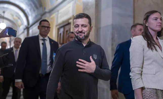 Ukrainian President Volodymyr Zelenskyy, center, gestures with his hand over his heart after a closed meeting with lawmakers in the House of Representatives about the war effort against Russia, at the Capitol in Washington, Thursday, Sept. 26, 2024. (AP Photo/J. Scott Applewhite)