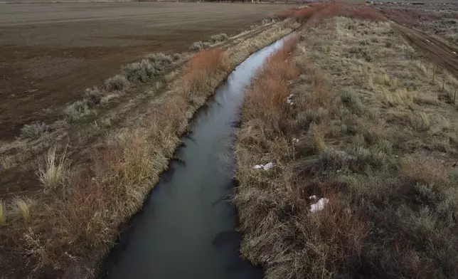 An irrigation canal is shown in Owyhee, Nev., March 13, 2024, on the Duck Valley Indian Reservation that straddles the Nevada-Idaho border. (AP Photo/Rick Bowmer)