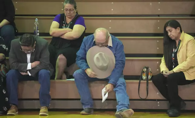 Tribal members gather in a gymnasium to pay their respects to Marvin Cota, who died from cancer, during a memorial service in Owyhee, Nev., on March 14, 2024, on the Duck Valley Indian Reservation that straddles the Nevada-Idaho border. (AP Photo/Rick Bowmer)