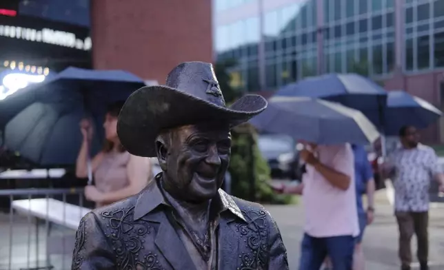 A statue of Grand Ole Opry star Little Jimmy Dickens is displayed outside the Ryman Auditorium in Nashville, Tenn., on July 30, 2024. (AP Photo/Luis Andres Henao)