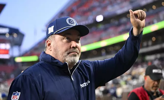 Dallas Cowboys head coach Mike McCarthy walks off the field after his team's NFL football game against the Cleveland Browns in Cleveland, Sunday, Sept. 8, 2024. (AP Photo/David Richard)