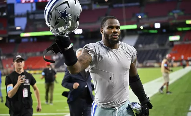 Dallas Cowboys' Micah Parsons celebrates as he walks off the field after the team's NFL football game against the Cleveland Browns in Cleveland, Sunday, Sept. 8, 2024. (AP Photo/David Richard)