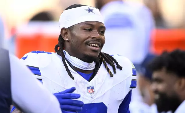 Dallas Cowboys wide receiver KaVontae Turpin celebrates on the bench after returning a Cleveland Browns punt for a touchdown in the second half of an NFL football game in Cleveland, Sunday, Sept. 8, 2024. (AP Photo/David Richard)