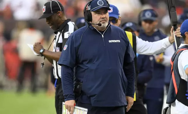 Dallas Cowboys head coach Mike McCarthy walks along the sideline in the second half of an NFL football game against the Cleveland Browns in Cleveland, Sunday, Sept. 8, 2024. (AP Photo/David Richard)