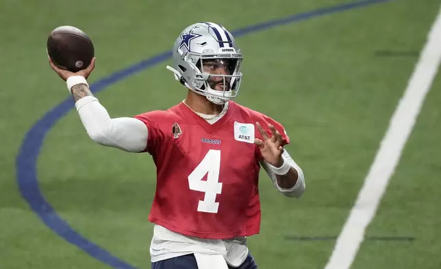 Dallas Cowboys quarterback Dak Prescott (4) throws a pass during an NFL football practice at the team's training facility, Wednesday, Aug. 28, 2024, in Frisco, Texas. (AP Photo/Tony Gutierrez)