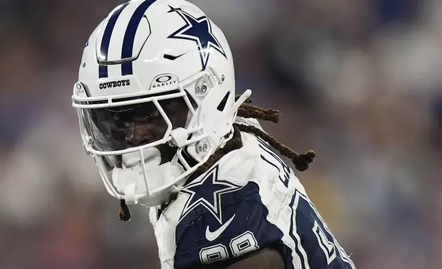 Dallas Cowboys wide receiver CeeDee Lamb (88) comes down with a pass on his way to scoring a touchdown against the New York Giants during the first half of an NFL football game, Thursday, Sept. 26, 2024, in East Rutherford, N.J. (AP Photo/Bryan Woolston)