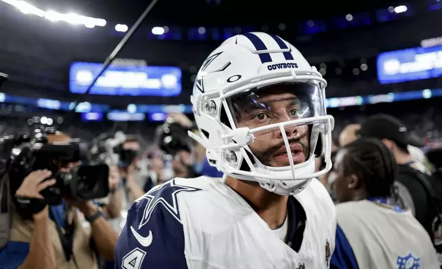 Dallas Cowboys quarterback Dak Prescott (4) walks off the field after playing against the New York Giants in an NFL football game, Thursday, Sept. 26, 2024, in East Rutherford, N.J. (AP Photo/Adam Hunger)