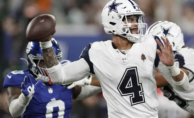 Dallas Cowboys quarterback Dak Prescott (4) passes against the New York Giants during the second quarter of an NFL football game, Thursday, Sept. 26, 2024, in East Rutherford, N.J. (AP Photo/Adam Hunger)